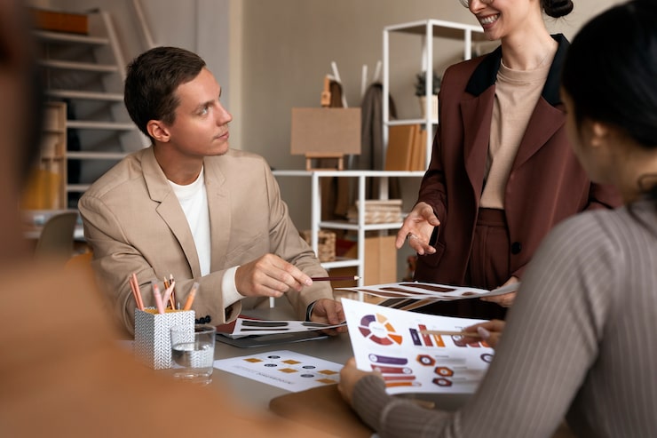 Small business team reviewing plans together